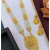 A beautiful gold necklace set with matching earrings