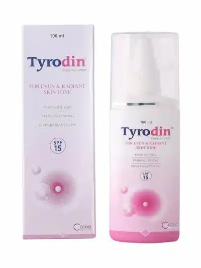 Tyrodin creamy lotion bottle with outer packaging showing SPF 15 and skin tone improvement benefits.