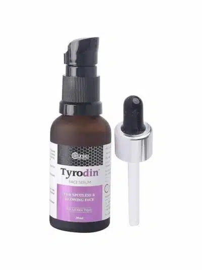 Tyrodin face serum bottle with pump and separate dropper placed beside it.