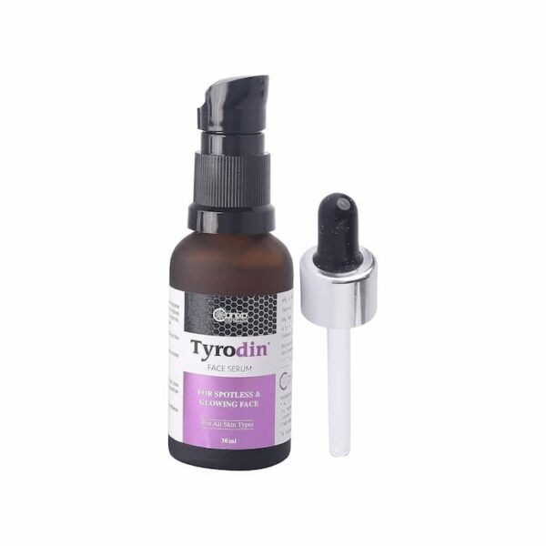 Tyrodin face serum bottle with pump and separate dropper placed beside it.