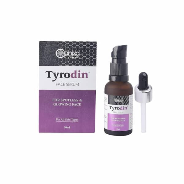 Tyrodin face serum bottle placed next to its outer box and dropper on a white background.