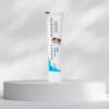 Acnetop acne treatment gel tube placed on a round display platform