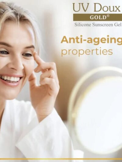 Model applying UV Doux Gold silicone sunscreen highlighting anti-ageing benefits
