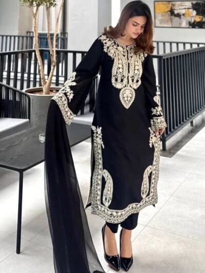 Women wearing black embroidered Pakistani party wear suit