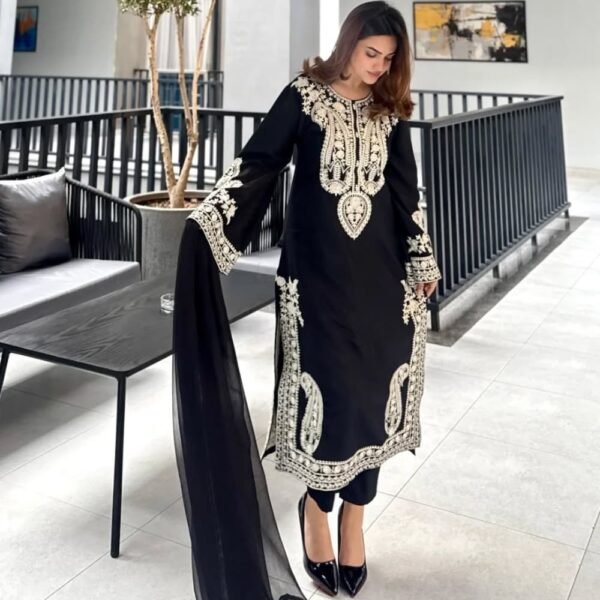 Women wearing black embroidered Pakistani party wear suit