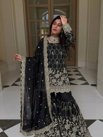 Women wearing black Pakistani wedding wear sharara suit
