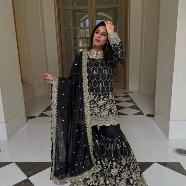 Women wearing black Pakistani wedding wear sharara suit
